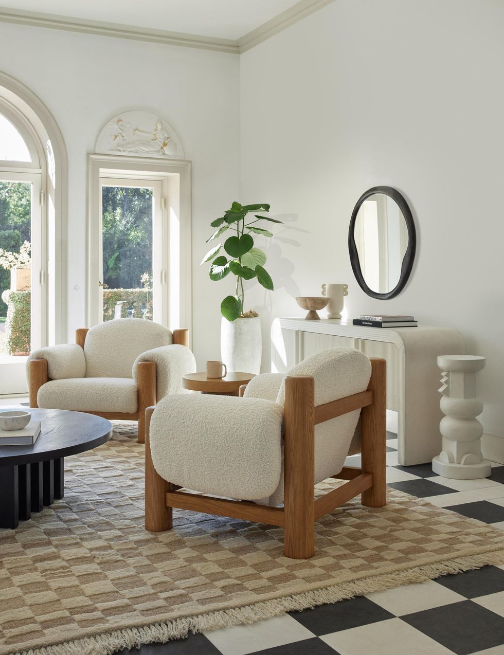 a tan checked rug on top of a black and white tile floor Lulu and Georgia