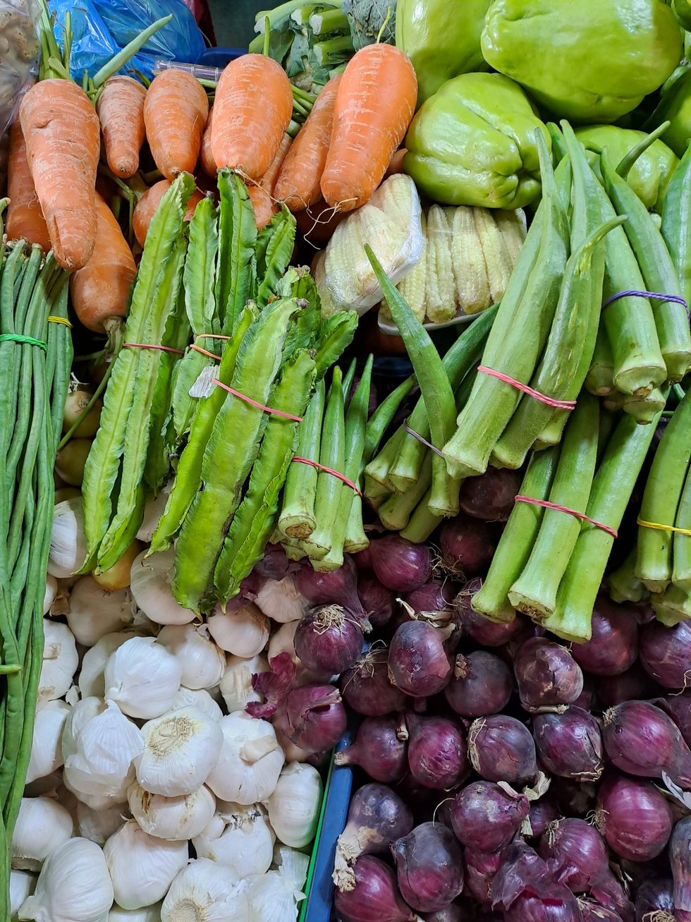 assortment of veggies like onions, garlic, and carrots