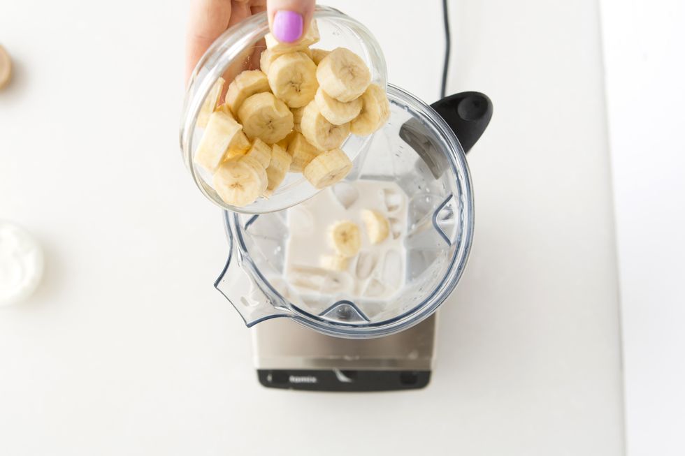 bananas going into a smoothie