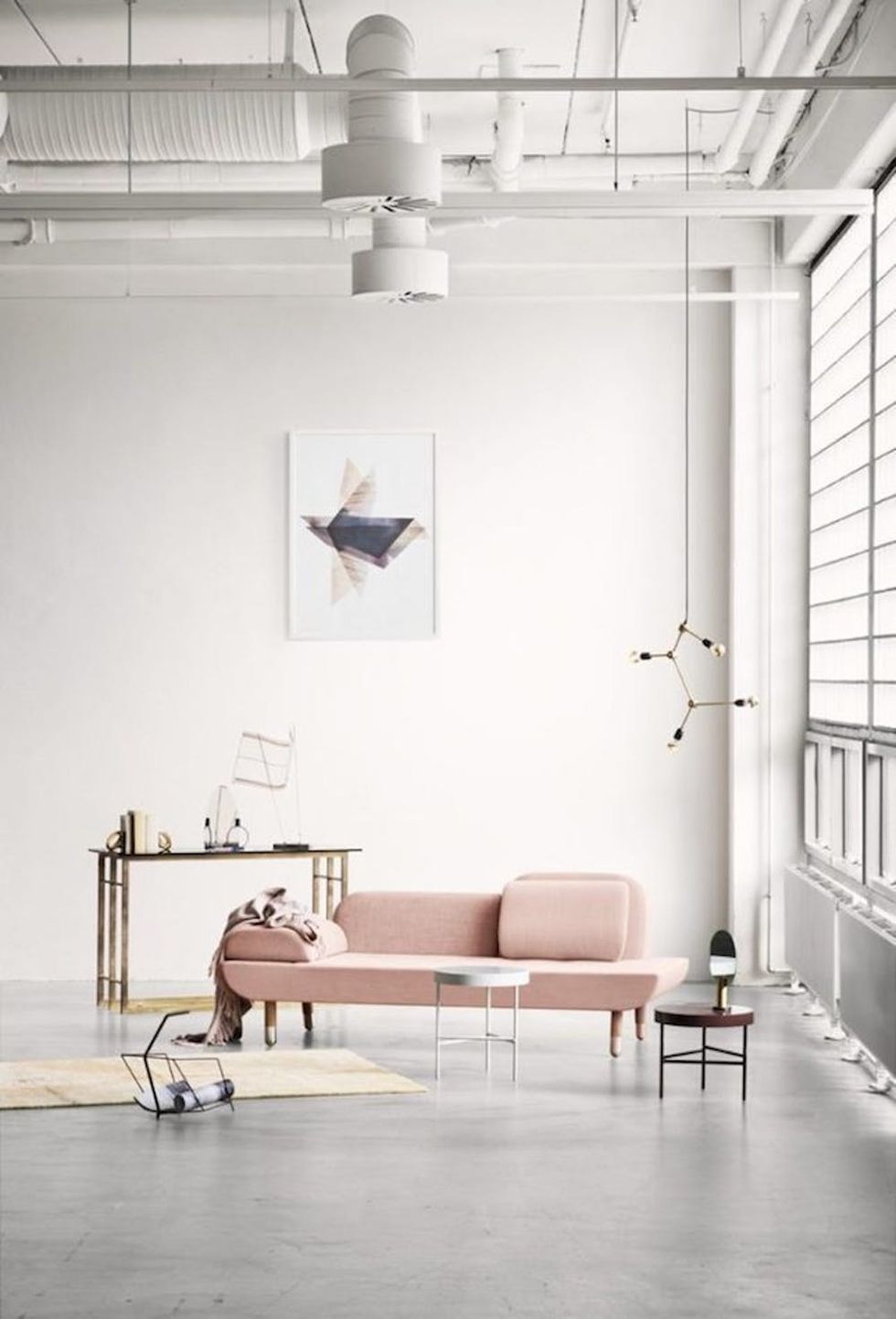 blush-pink-sofa-in-the-minimalistic-industrial-living-room-696x1024