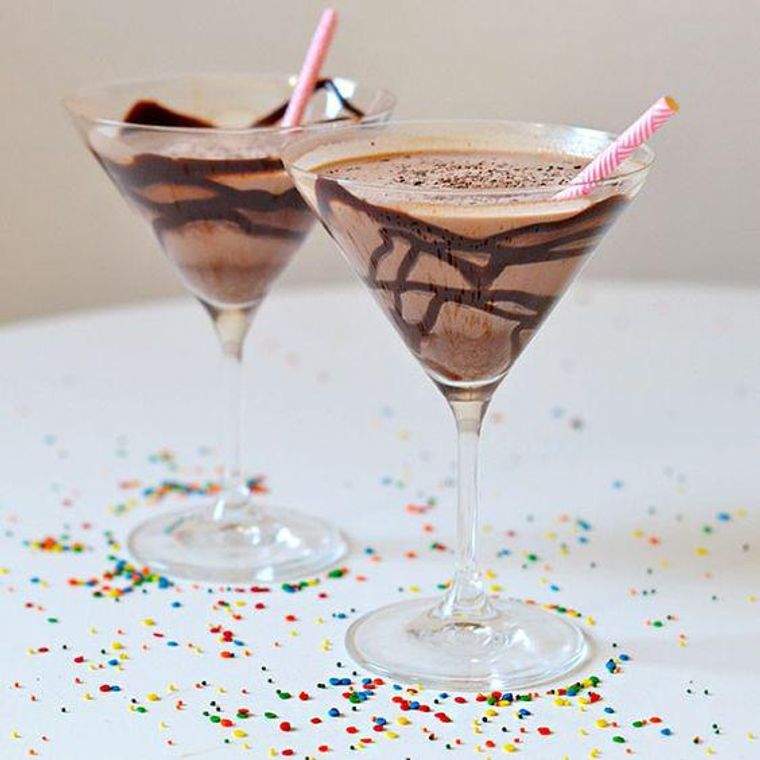 https://www.brit.co/media-library/chocolate-martini-in-a-glass-with-pink-paper-straws-and-rainbow-sprinkles-all-around.jpg?id=27007855&width=760&quality=90