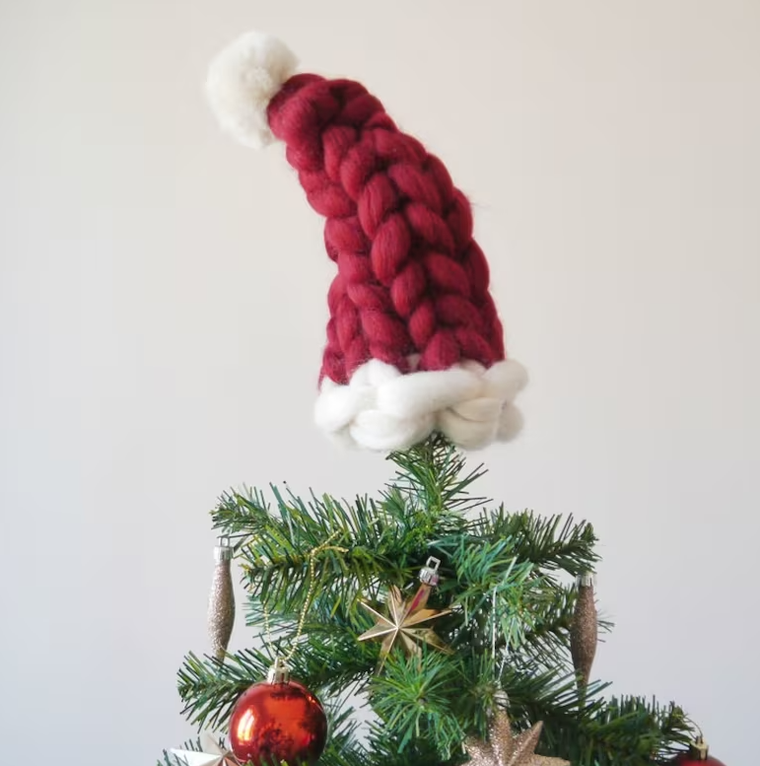 https://www.brit.co/media-library/chunk-knit-santa-tree-topper.png?id=50406382&width=760&quality=90