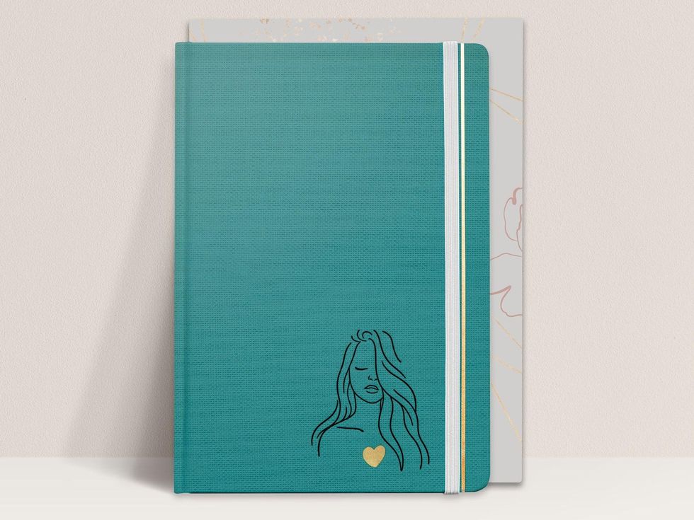 Clothbound gratitude journal in teal with sketch of woman.