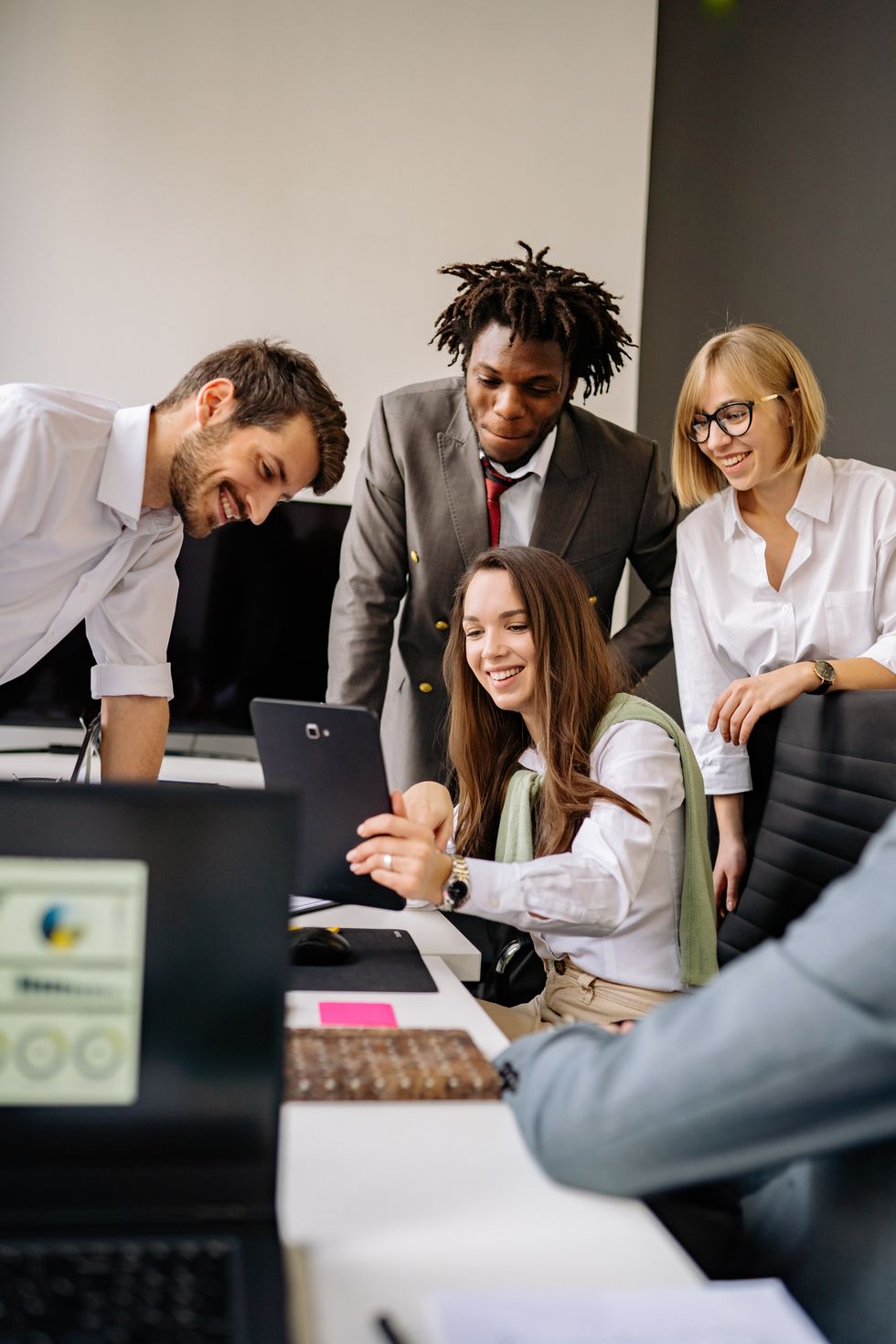 colleagues working together at a desk