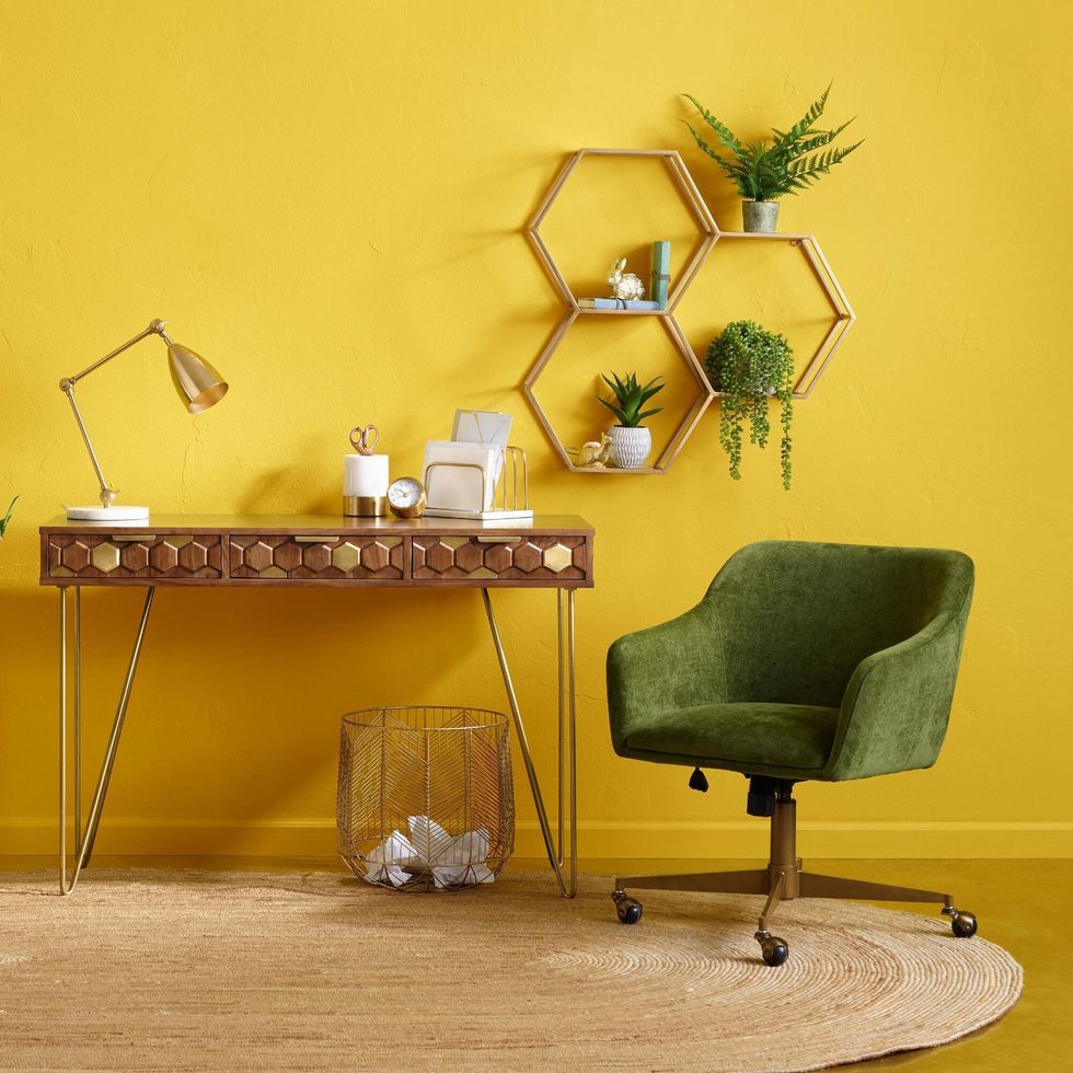 colorful office with yellow walls and green chair