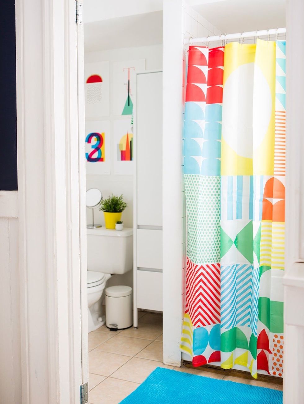 colorful shower curtain with blue bath mat