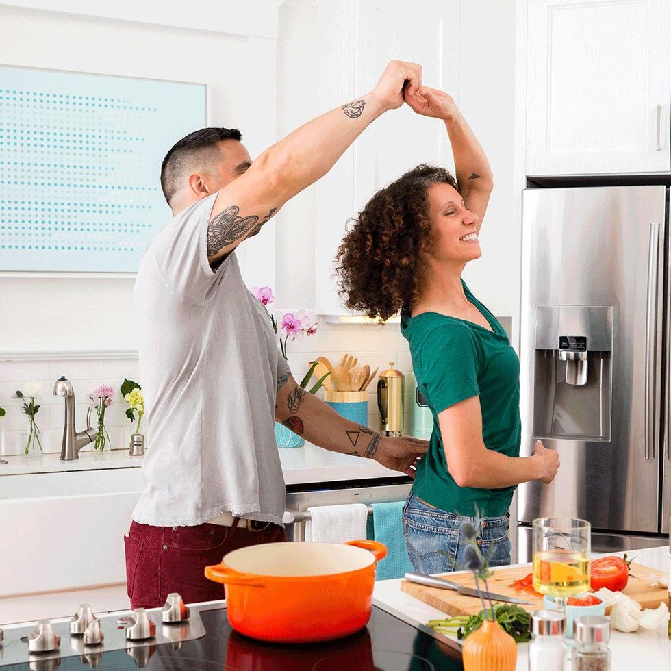 couple dancing in their kitchen