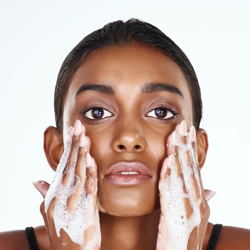 washing face with water