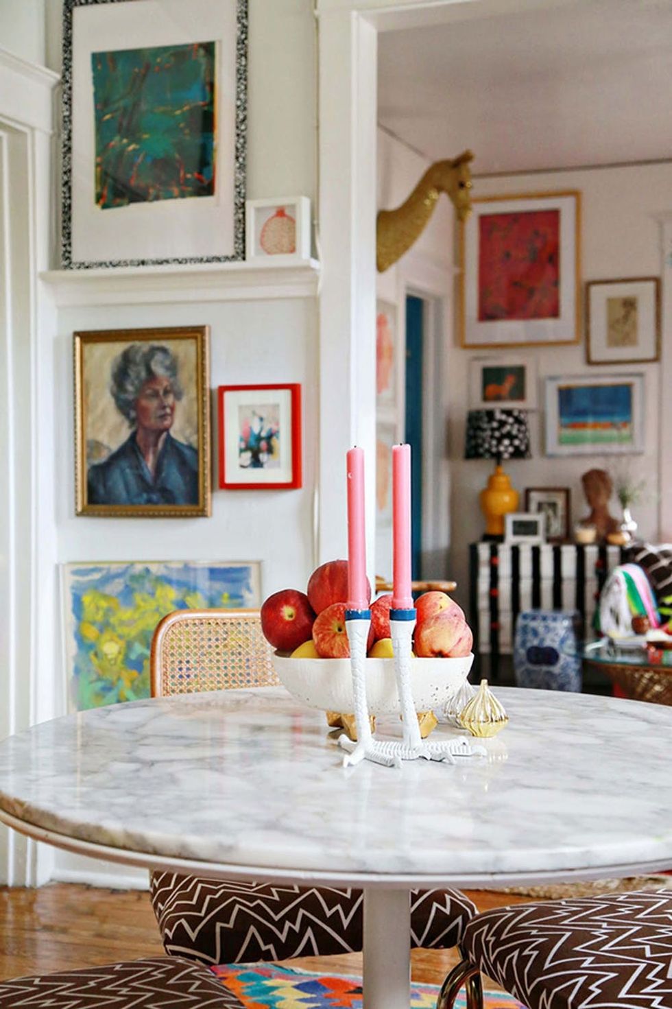 neutral walls with colorful artwork and decor