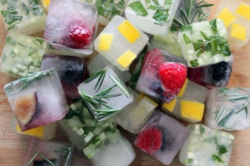 diy fruit ice cubes with berries, figs, mango and other fruit in them