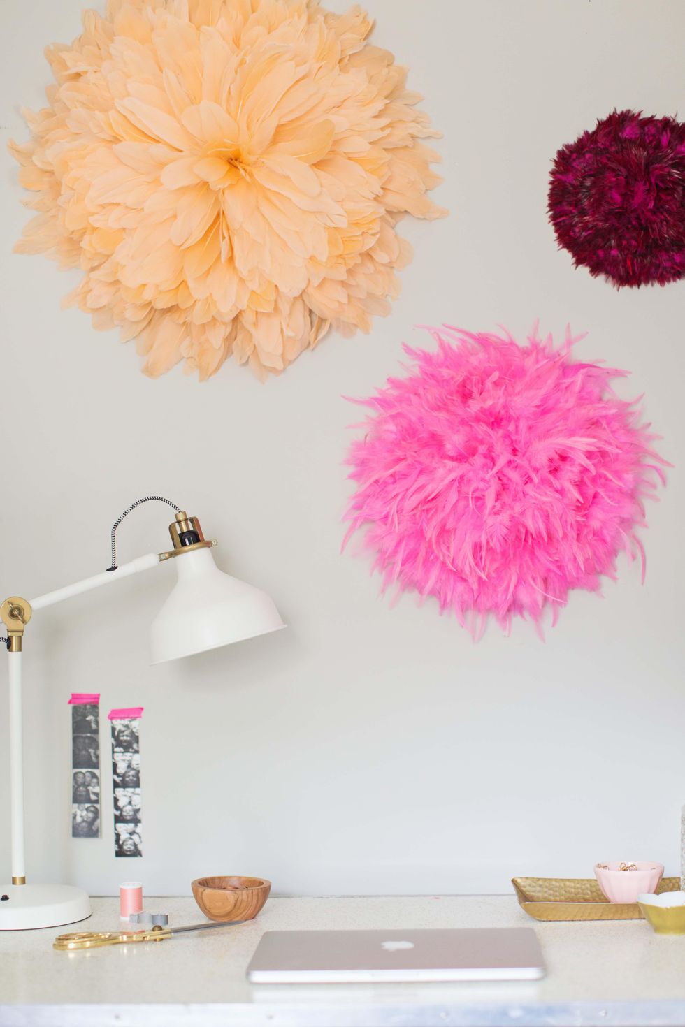 peach and hot pink diy juju hat wall art on a white wall