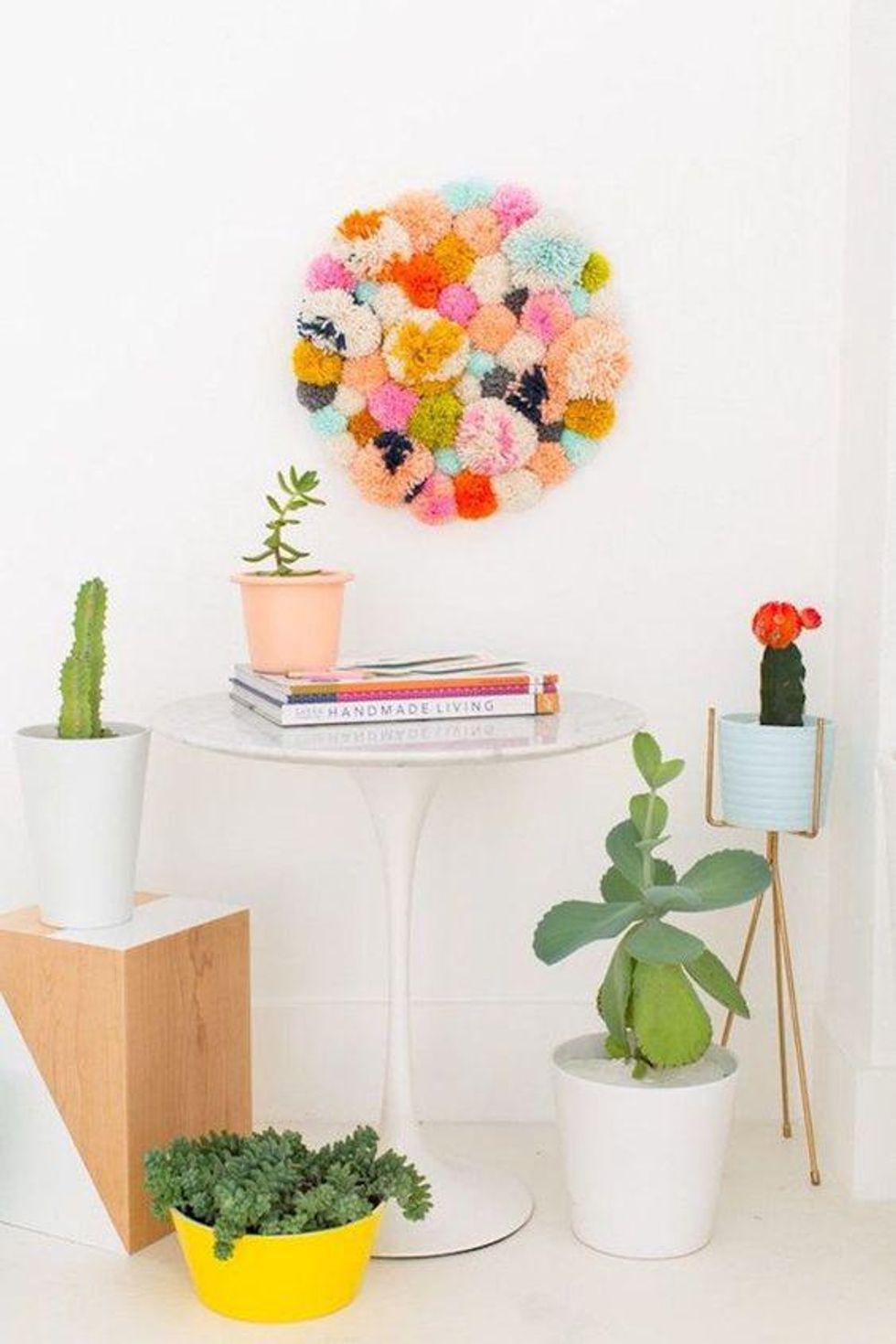 diy pom pom wall hanging with multicolored yard