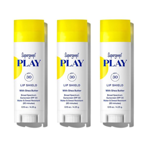 supergoop spf lip shield trio in white, blue, and yellow tubes