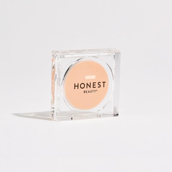 honest beauty balm in a clear container