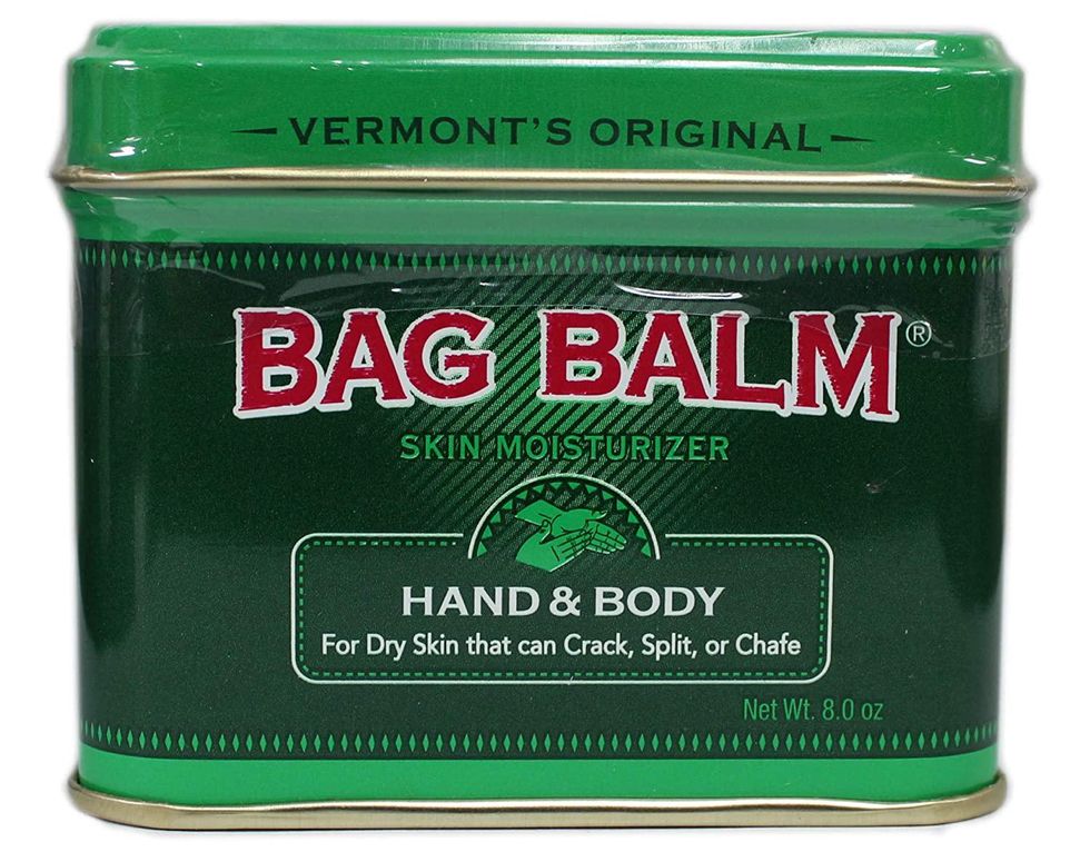 green, red, and white tub of bag balm lip balm