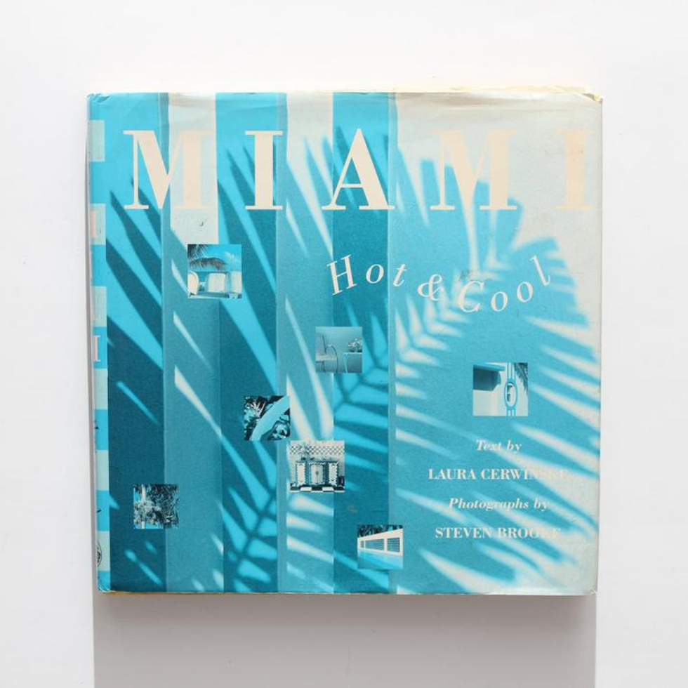 blue palm leaf design and white writing on cover of miami book