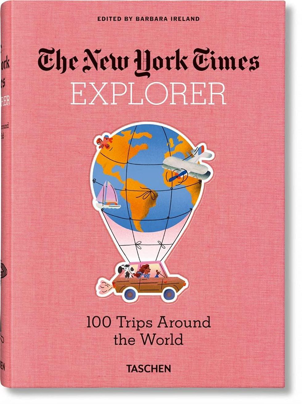 pink book with black writing and a car attached to a hot air balloon that looks like the earth