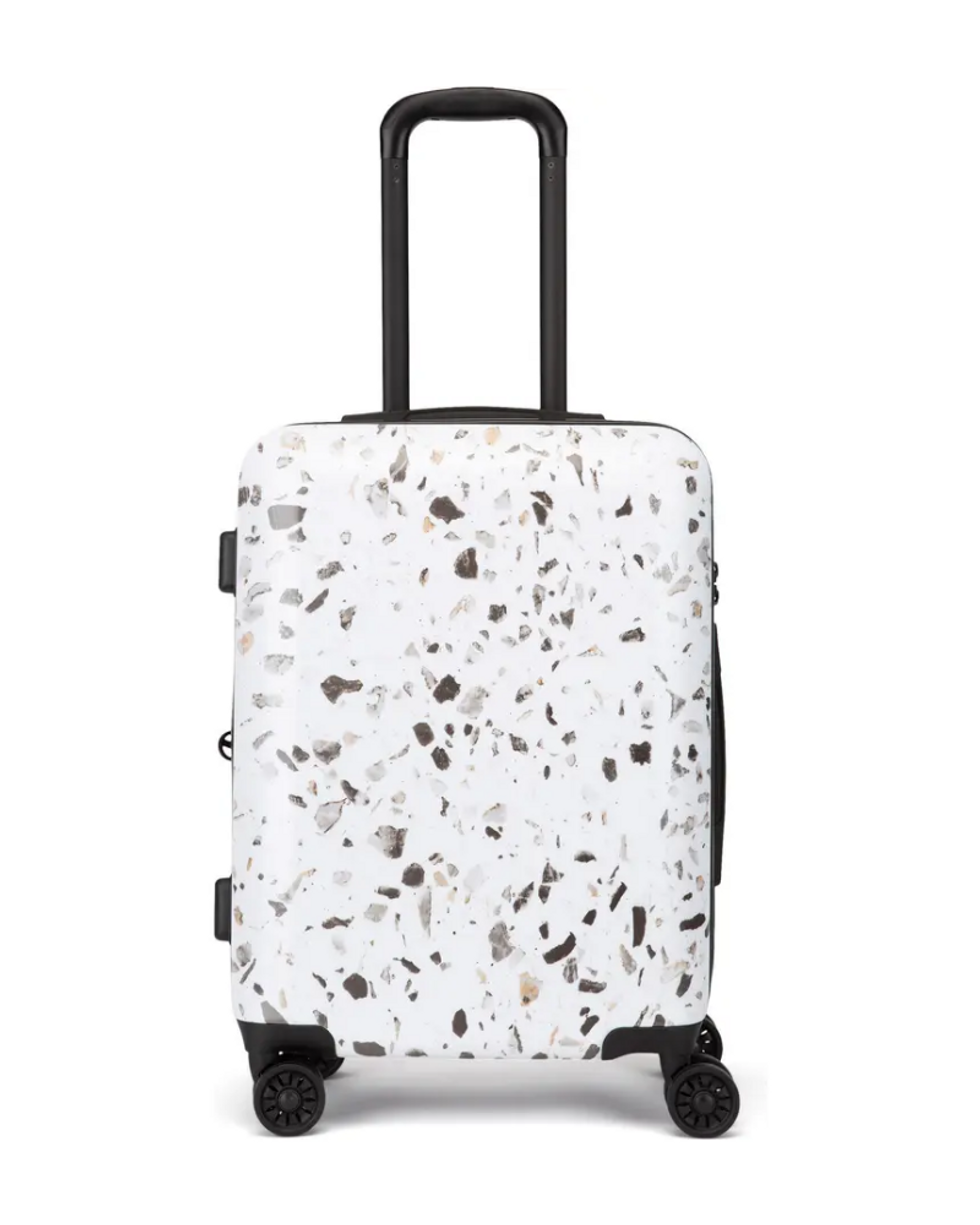 black and white Calpak Terrazzo Carry-On Suitcase