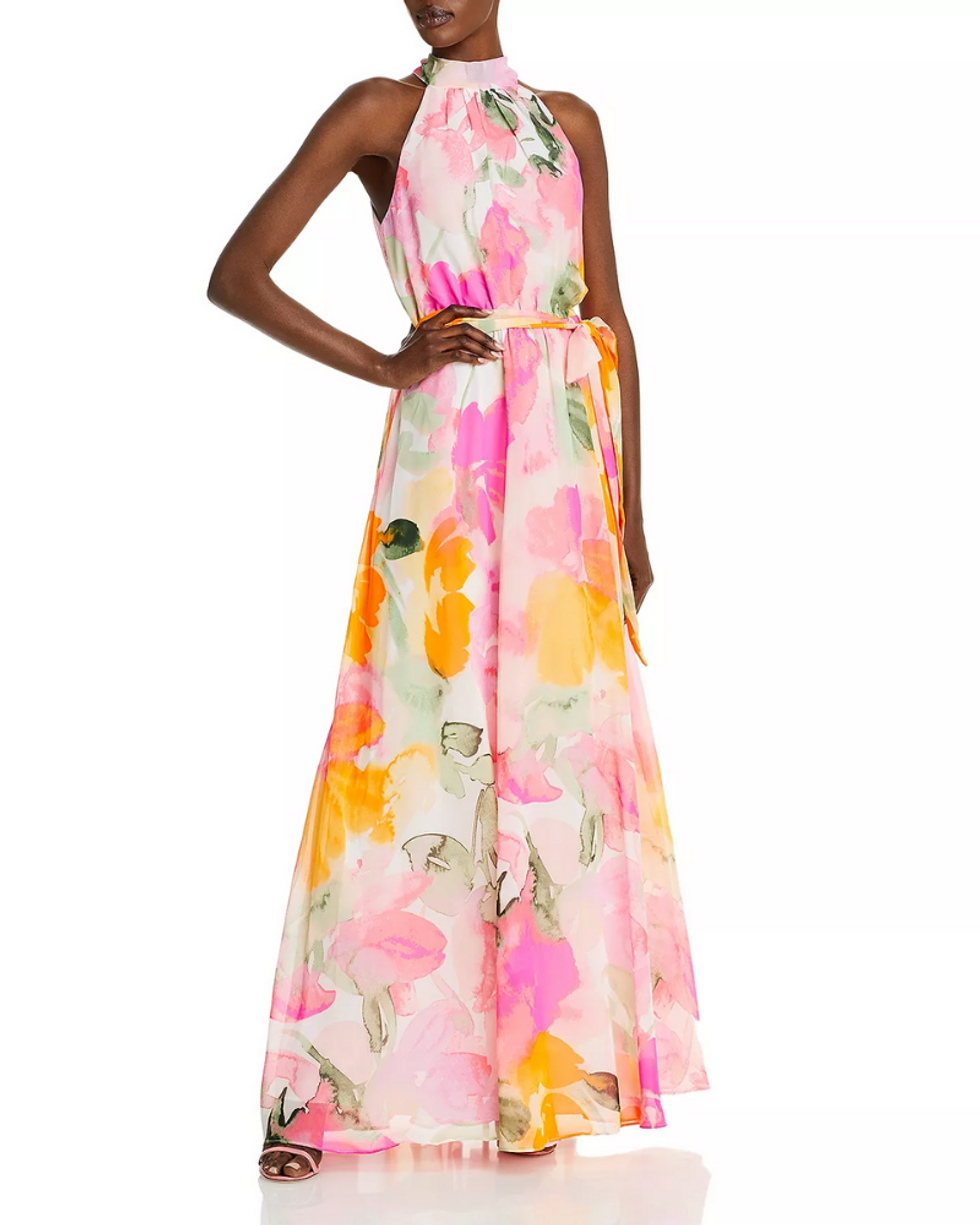 model wears a floor length watercolor floral dress