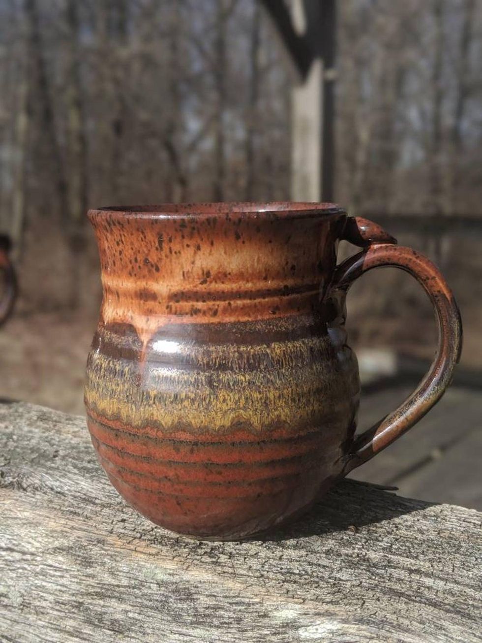 brown clay ceramic coffee mug