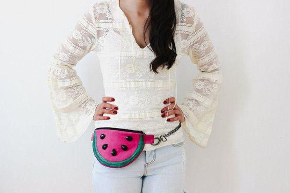 pink and green fanny pack with chain belt