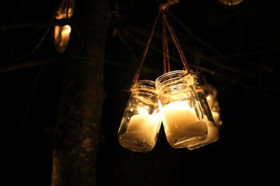 candles in the jar illuminating during the night