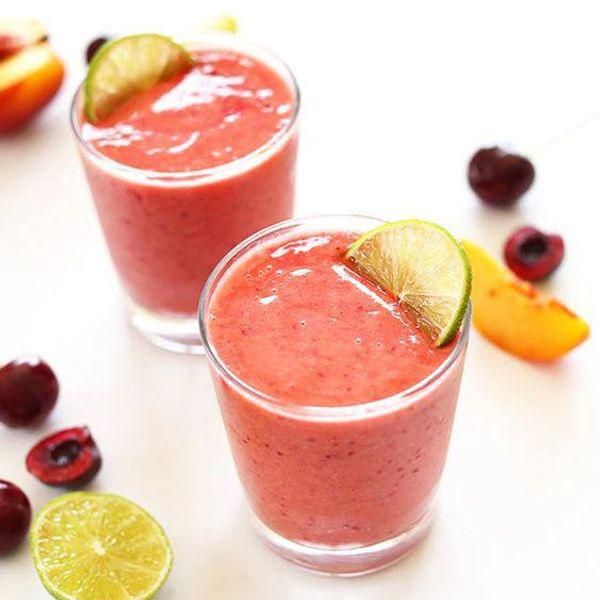 pink Cherry Limeade Smoothies with green lime garnish