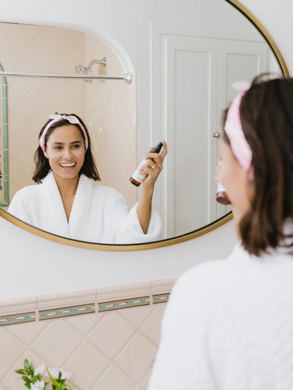 woman using face spray