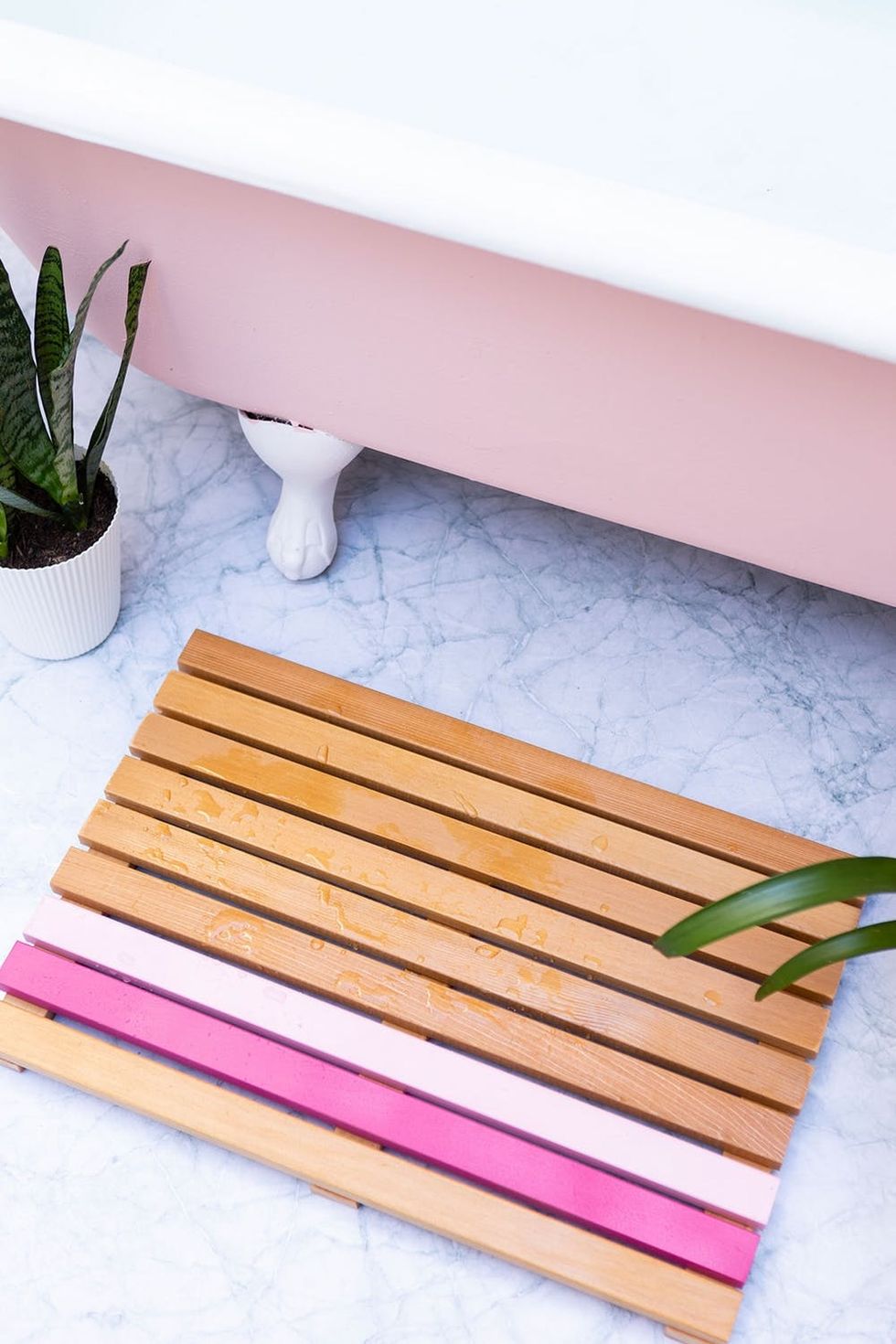 finished bath mat with pink stripes