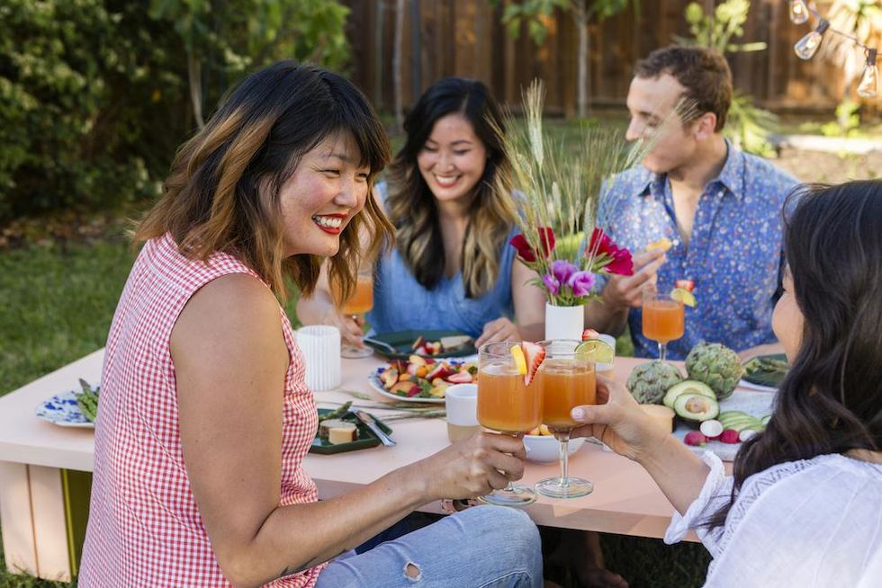 friends eating outside together for quality time love languages