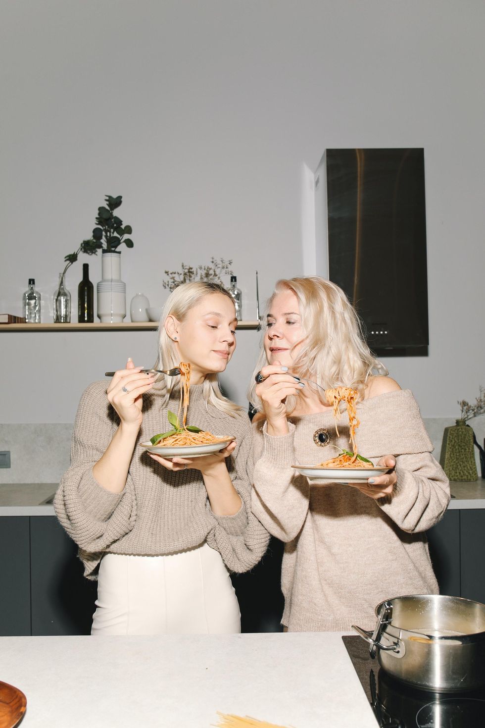 friends tasting dinner together