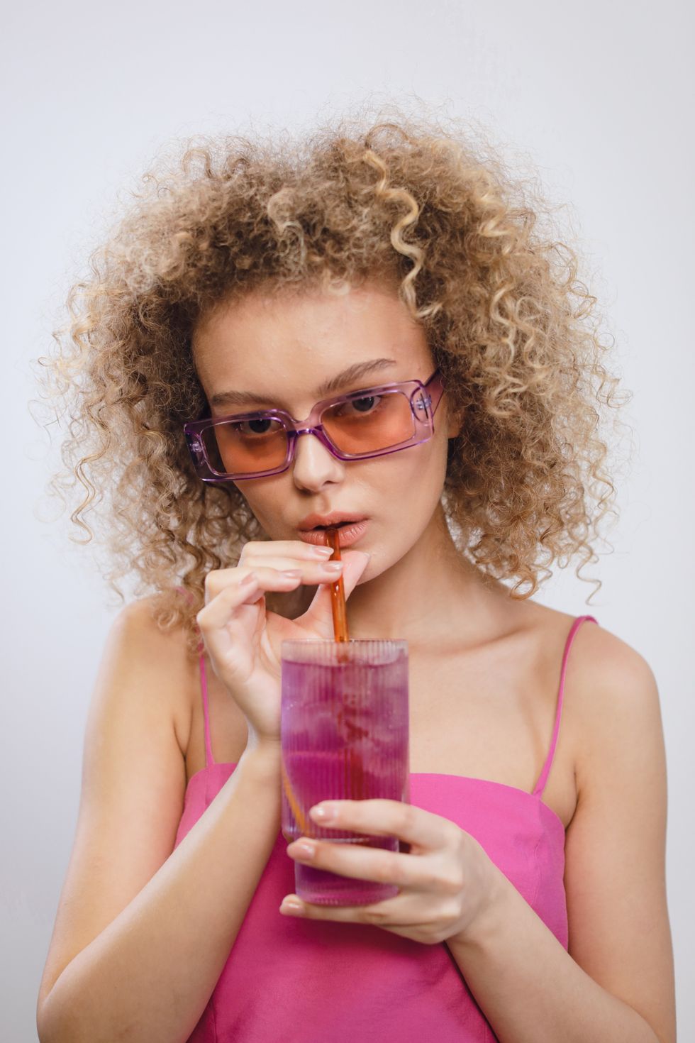 girl drinking colored water