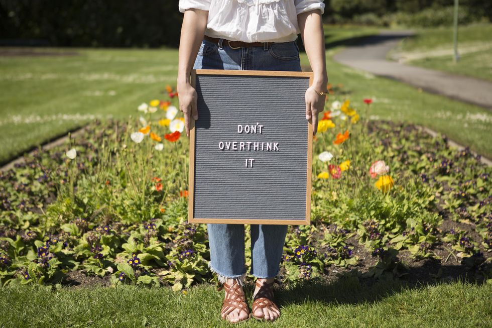 girl standing in a garden earth day sustainability