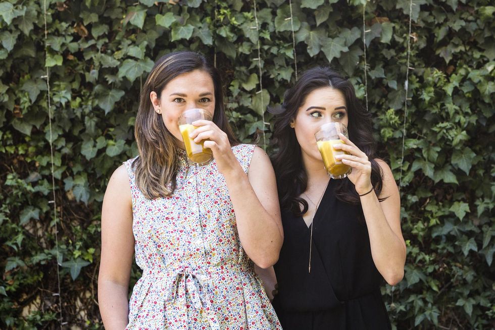 girls drinking turmeric latte golden milk