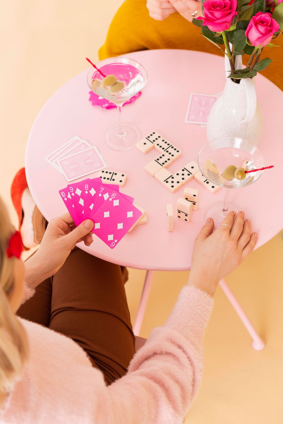 girls playing at a card table