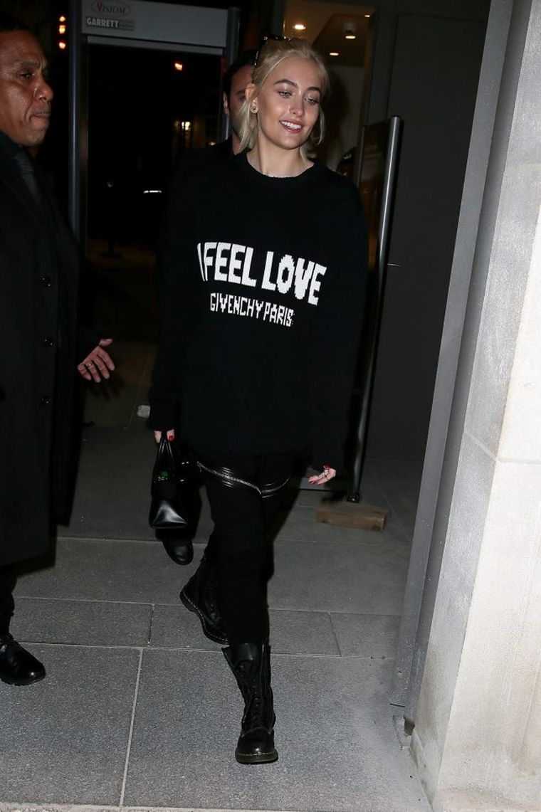 Bella Hadid Wears Sweater Dress, Tights & Chunky Combat Boots in Paris