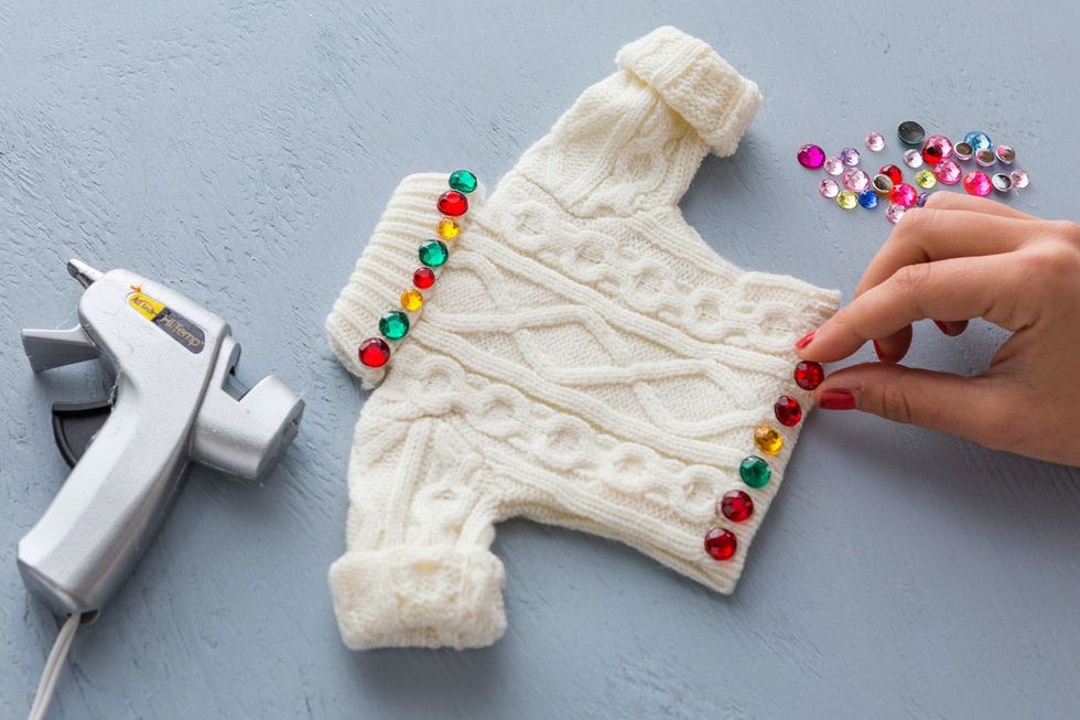 gluing rhinestones onto the Ugly Sweater Ornaments