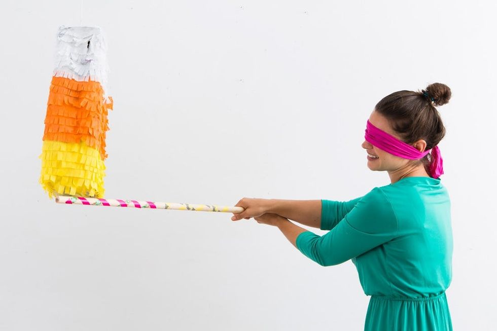 DIY This Candy Corn-Filled Candy Corn Piñata - Brit + Co