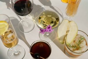 a few gin drinks sitting together on a tabletop