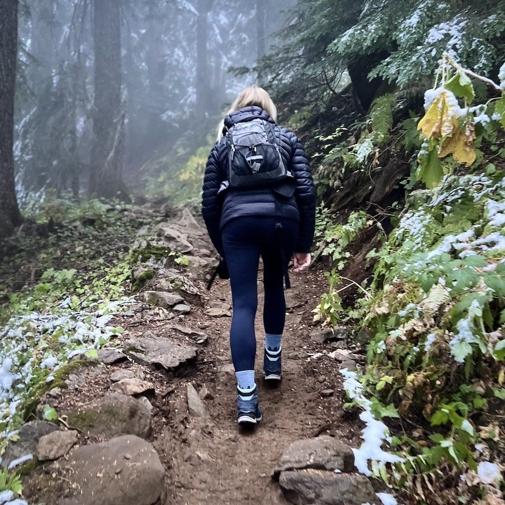 woman hiking in the snow weekly horoscope january 6