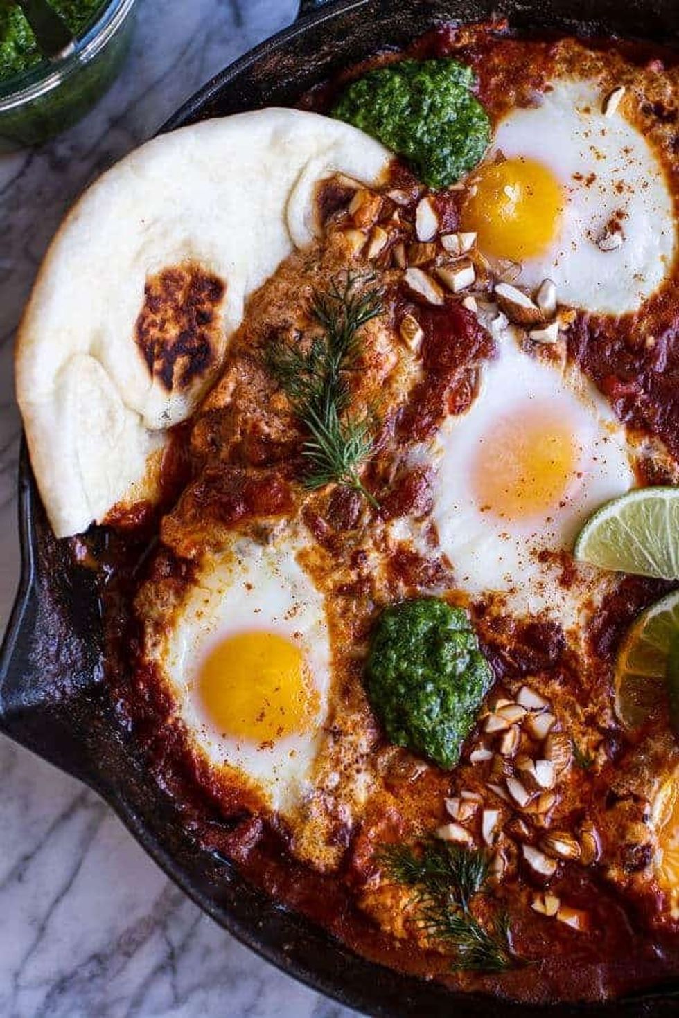 https://www.brit.co/media-library/indian-style-baked-eggs-with-green-harissa-naan.jpg?id=33246915&width=980