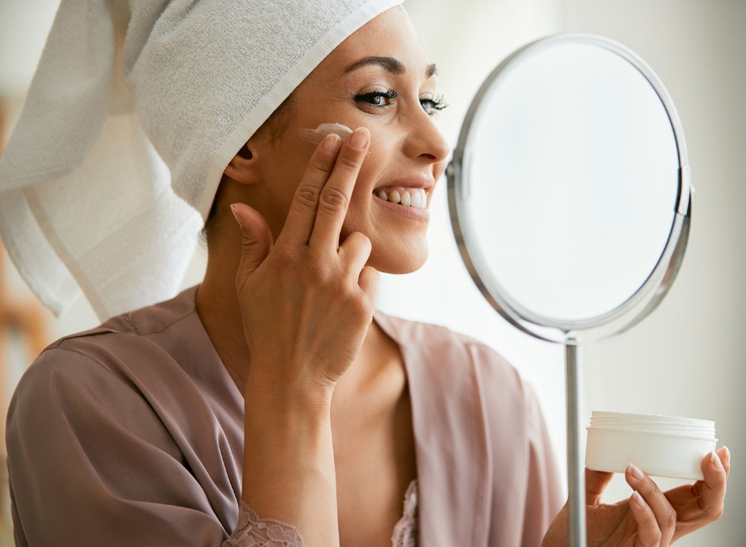 Woman applying skincare