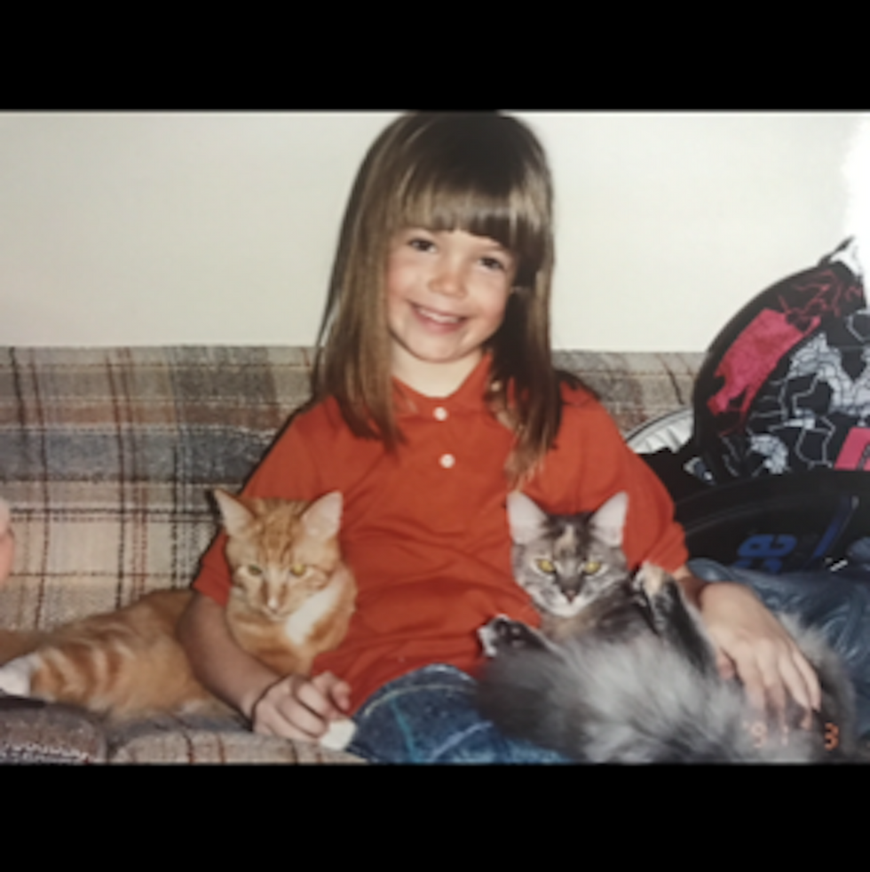 mandy moore as a child with two of her cats