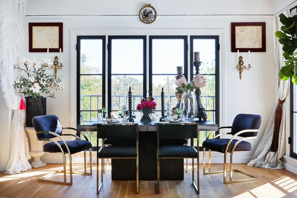 navy and magenta dining room with brass accents