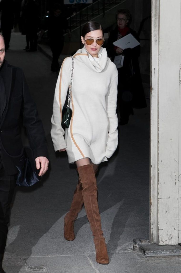 Bella Hadid Wears Sweater Dress, Tights & Chunky Combat Boots in Paris