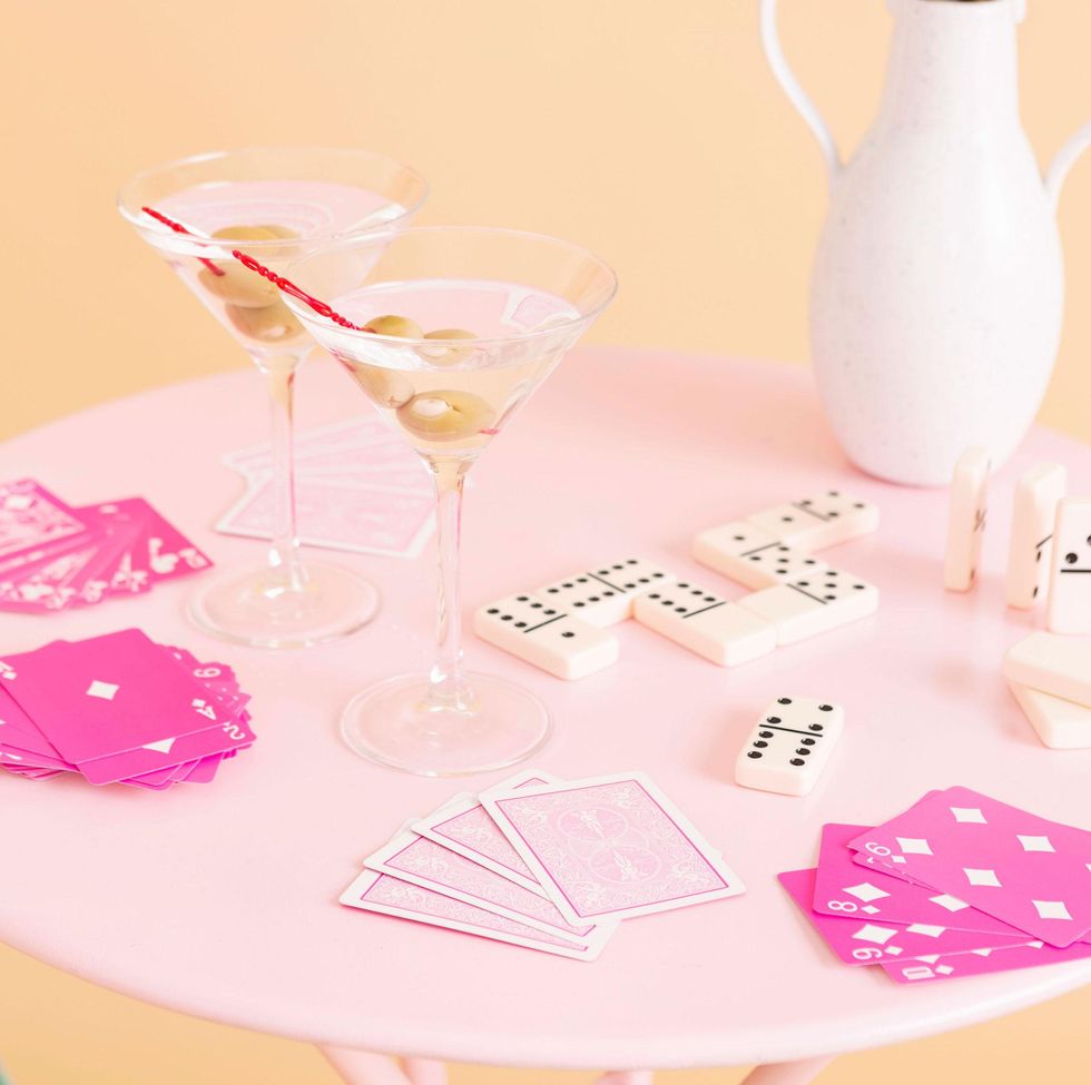 pink table with dominos cards