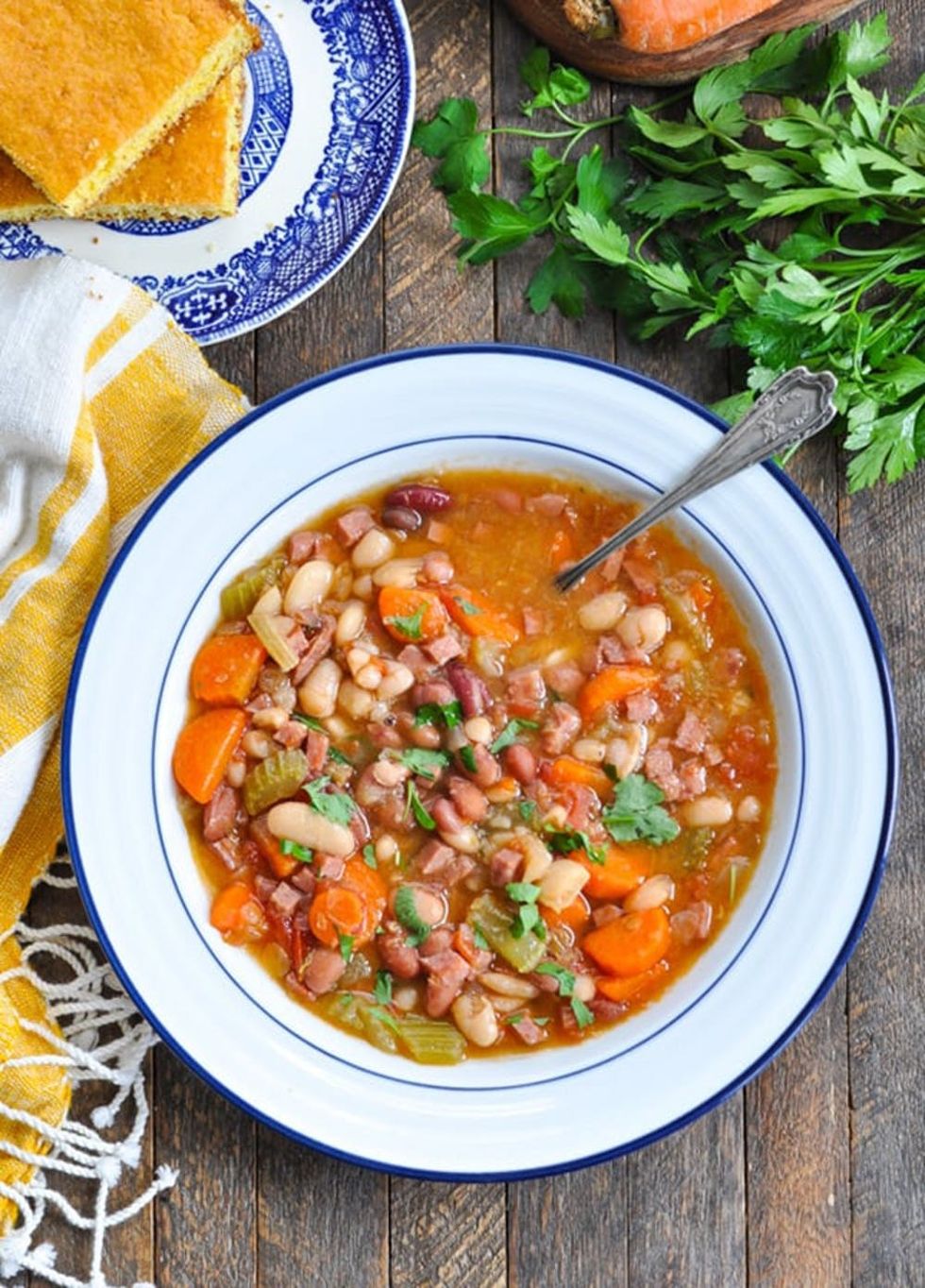 Plate of Slow-Cooked Bean Soup with cornbread on the side