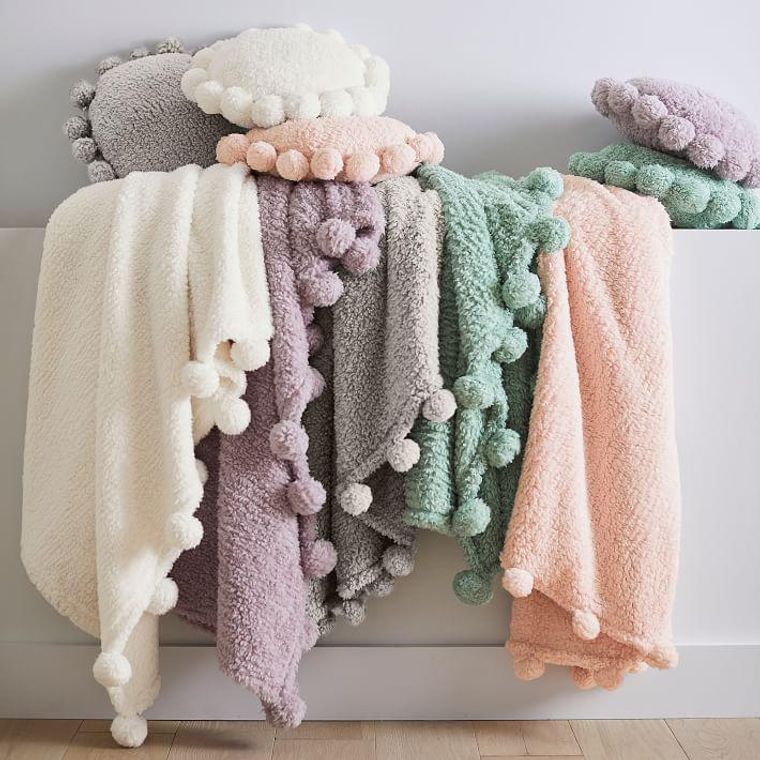 https://www.brit.co/media-library/pompom-throw-blanket.jpg?id=29535981&width=760&quality=90