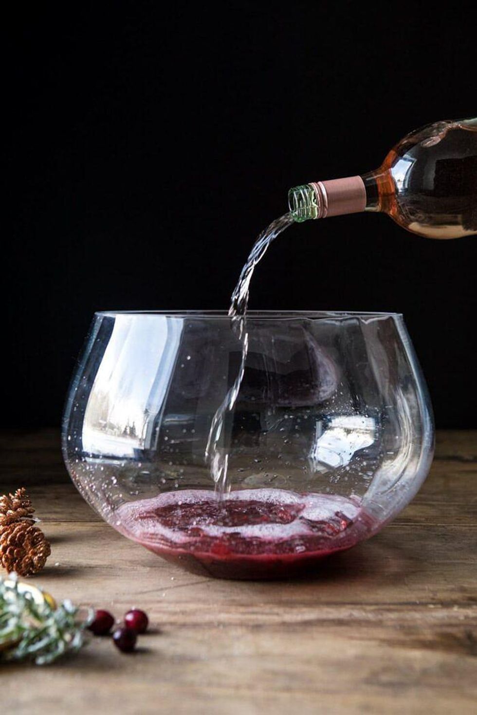 Pouring spritzer into a punch bowl