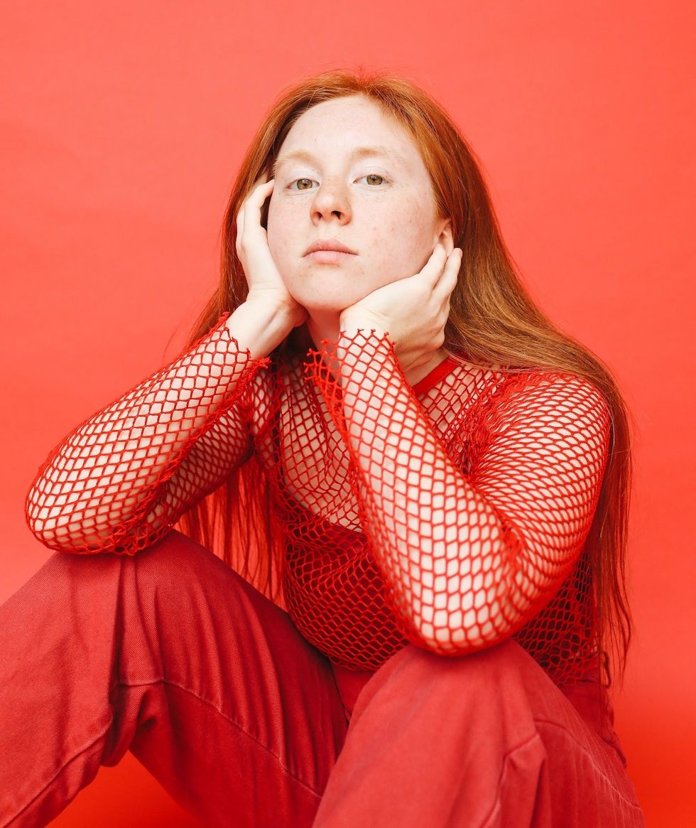 red outfit with fishnet top